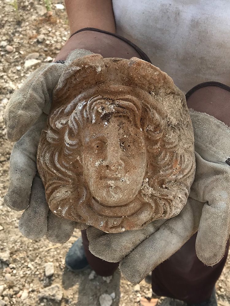 Gorgon antefix (likely 3rd to 2nd century BC), found in a dump of material within the theatre following its abandonment. The antefix probably belonged to an earlier nearby building.